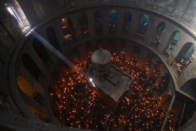 An AP reporter spends the night locked inside Jerusalem's holiest church with clergy and pilgrims