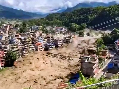 What triggered the catastrophic flood on the Nepal-Tibet border?