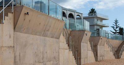 Residents push to build sea walls on beach to save homes from erosion