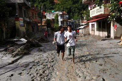 Survivors of Nepal flash floods describe being hit by ‘wall of water’: ‘My wife is still beneath the mud’