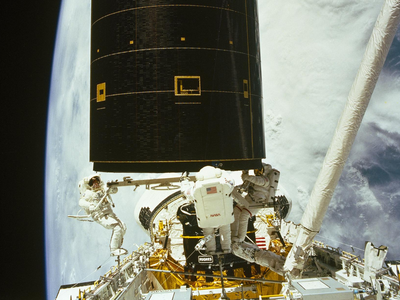 In 1992, Endeavour rescued stranded Intelsat VI; three astronauts captured it by hand, and a new booster sent the satellite to geosynchronous orbit