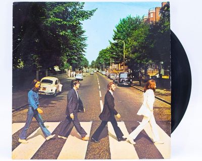 Focus on Paul McCartney’s feet down below his knee
