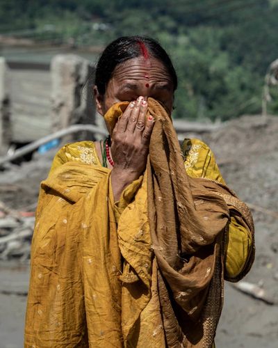 ‘The flood took everything I have’: survivors grieve for relatives and homes swept away in Nepal