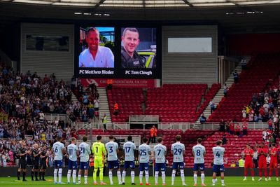 Football fans pay respects to officers killed in A66 crash