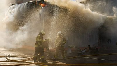 At least 37 killed after Russian strike sparks major fire and explosions at a warehouse in Bucha