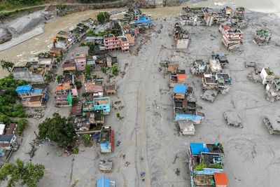 Bodies wash up in neighbouring India and as far as 250 miles downstream from Nepal disaster