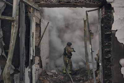 Russian drone strike on Kyiv warehouse storing weapons kills at least 37