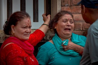 Desperate families gather across Nepal in search for missing loved ones as flash flood death toll rises to 750