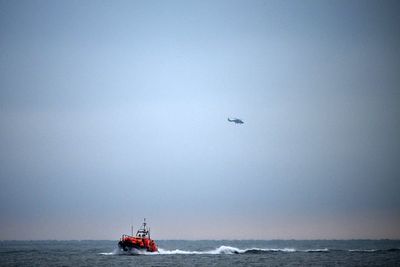 Two crew from fishing boat that sunk in the English Channel still missing after three found alive