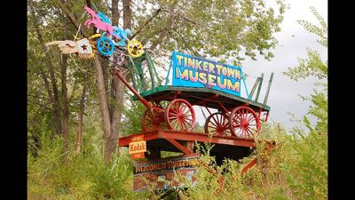 A New Mexico carver, Ross Ward, spent decades building Tinkertown from carved wood and 50,000 discarded bottles; the 22-room museum opened to visitors in 1983