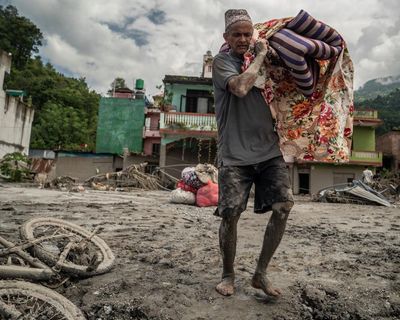 Devastated by floods and overwhelmed by bodies, Nepalis weep for what remains of their homes