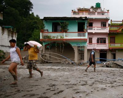 ‘The house got carried 100 metres away’: some Nepal flood victims had minutes of notice. Others had seconds