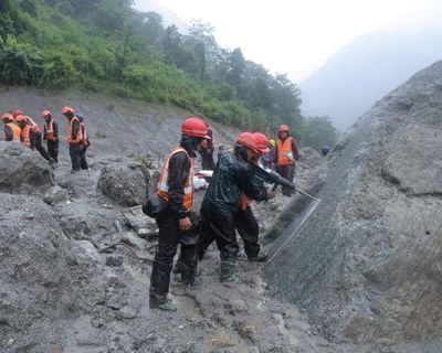 Nepal rescuers race to reach hundreds feared trapped in hydropower tunnels