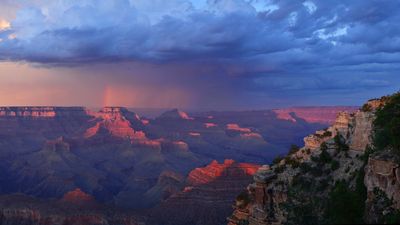 Normally arid Grand Canyon hit with deadly flash floods, leaving two dead and at least 15 missing. More rain is expected