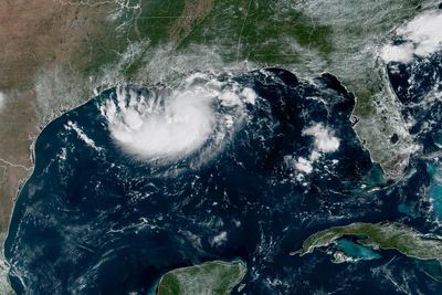 Tropical Storm Edouard heads for Texas and Louisiana while a storm moves toward Hawaii