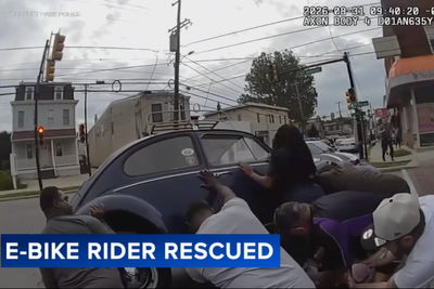 Moment Good Samaritans lift a car to free e-bike rider trapped underneath
