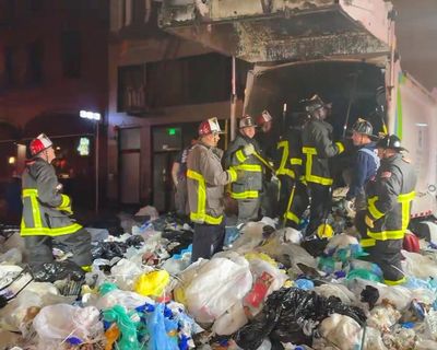 San Francisco fire officials rescue man trapped inside garbage truck