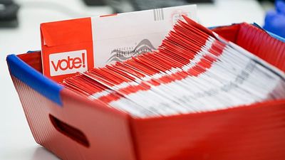 Trump presses Supreme Court to curb mail voting as ballots begin reaching Americans