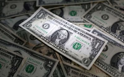 Dollar bounces on job gains, then pares ahead of CPI