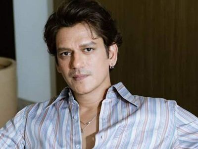 Mirzapur actor Vijay Varma’s Mumbai home features floor-to-ceiling glass windows, charcoal-toned interiors, statement furniture, lush indoor plants, an eclectic dining area, a sleek dark kitchen, a cosy bedroom and a personal collection of shoes, perfumes and hats