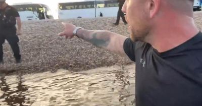 Far-right agitator vomits and claims 'police can't touch you in sea' in bizarre video