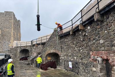 Historic cannon welcomed home to Carrickfergus Castle after restoration work