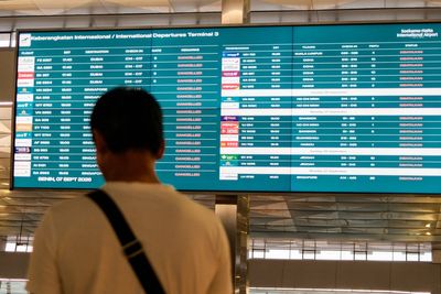 Indonesia reopens airports after volcanic eruption strands 350,000 travellers