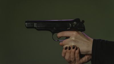 National Guard member argued with a colleague over hairstyle regulations. Then witnesses said he pulled a loaded pistol on her: ‘Playful banter’