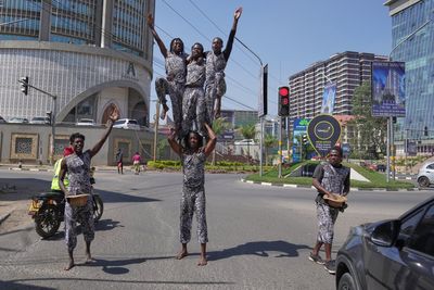 Street acrobats entertain motorists stuck in the Kenyan capital's notorious traffic