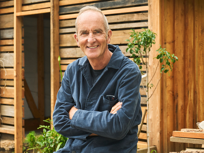 In 2012, Kevin McCloud built a tiny woodland home from salvaged materials; a year later, he moved and upgraded it on a Somerset cliff using waste-powered electricity