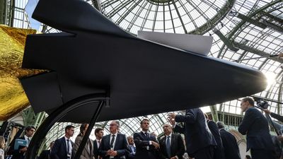Macron calls for 'shared governance' of space at Paris summit