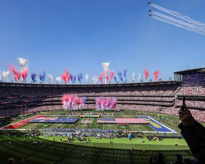 Crowd of 100,000 laps up relentless sensory experience as NFL woos Melbourne