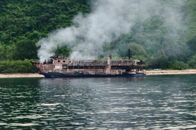Desperate search for 84 missing as rescue teams finally board burnt-out Philippines ferry