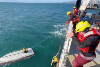 Teenage boy rescued off Alaska days after fishing boat capsized and his brother and cousin died