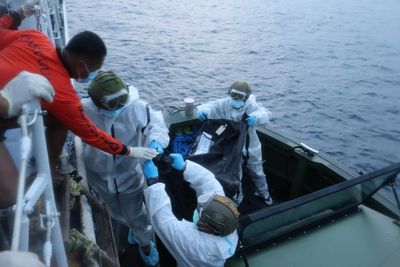 Bodies from charred Philippine ferry arrive at port after fire that killed at least 35