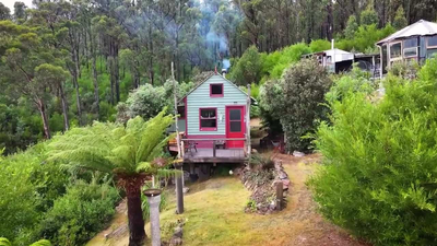 At 21, an Australian artist bought 25 acres in Tasmania; 18 months later a bushfire...