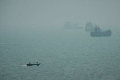 An Iranian commercial ship is struck near Strait of Hormuz with 1 dead, Iranian media say