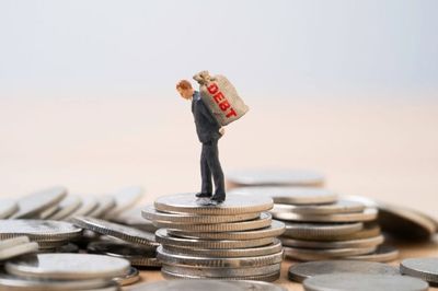 Is It Better to Have $50,000 Invested and $10,000 in Debt — Or No Debt and $40,000 Invested?