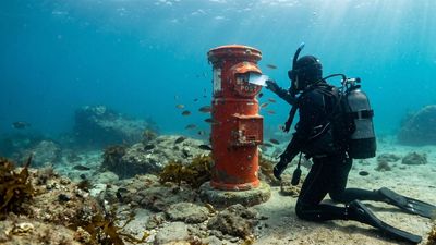 Twenty Years Of Mail Under The Sea: Underwater postbox transforms Susami; divers send 38,000 postcards
