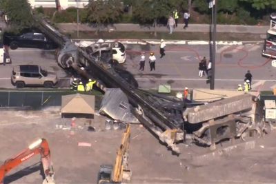 Investigation launched after construction site crane collapses on moving car
