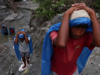 ‘Miracles do happen’: Families await news of pilgrims missing after Nepal-China flood