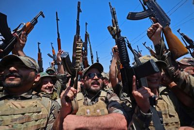 Militias in Iraq remain defiant as the last US troops pack up to leave