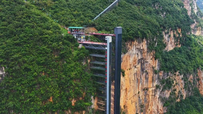 Children in China trekked 3 hours up and down an 800m cliff to school; two elevators and a cable car cut it to 30 minutes