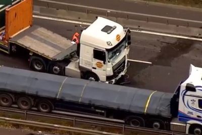 M3 closed after two lorries crash spilling 300 litres of fuel across motorway
