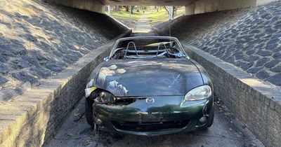 Stolen convertible set ablaze at Florey underpass