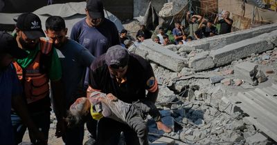 Building damaged by Israeli bombing collapses, killing 21 people including children