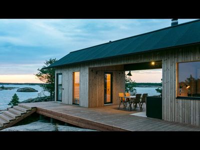 They spent 5 years searching Google Maps for an island, found a 5-acre Finnish island and built a solar-powered dream home they now rent for $2,400 a night