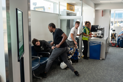 Airport Fight Erupts After Man Uses N-Word Before Being Repeatedly Punched as Passengers Watch and Cheer