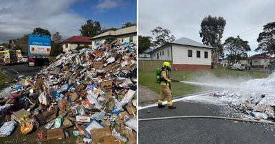 Garbage truck forced to dump burning load on road at Wallsend