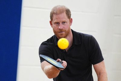 Harry plays pickleball with children as controversy continues to cloud royals